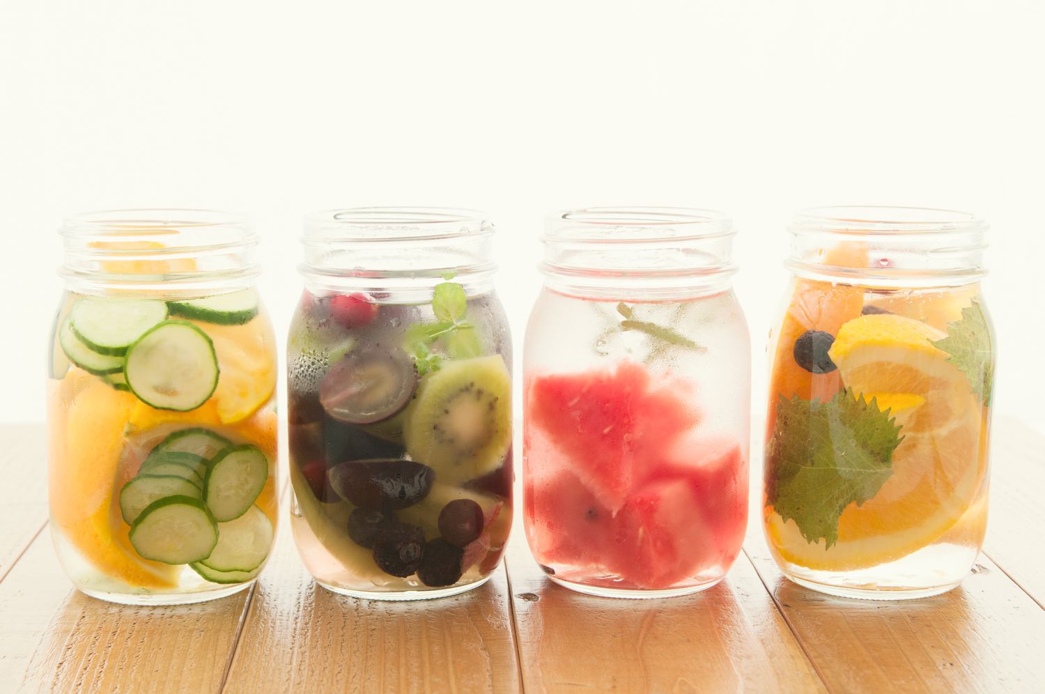 4 mason jars water met fruit erin